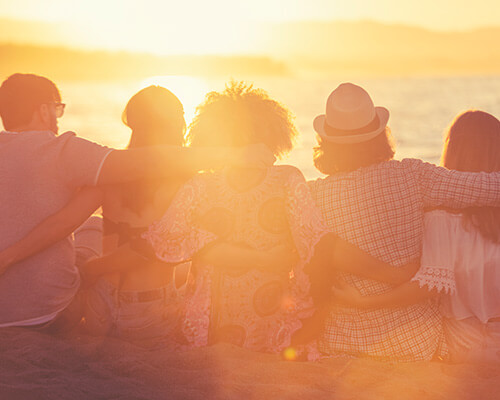 Group at sunrise on beach